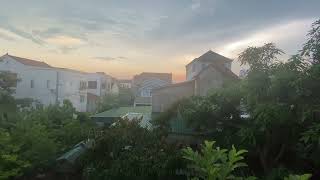 Afternoon falls, the last sunlight of the day glides through the tiled roof