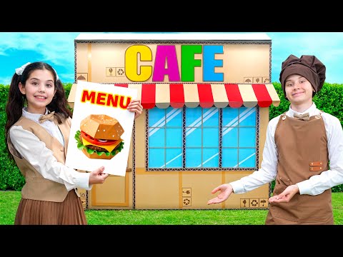 Eva y los niños juegan a la aventura en el Café de cartón