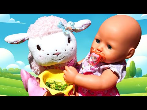 Baby Annabell doll goes to the toy zoo and meets new friends! The baby doll feeds toy animals.