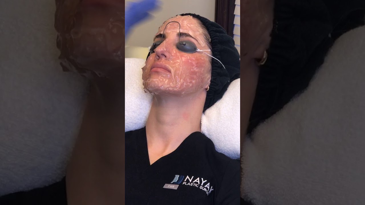 Facial treatment in a professional skincare setting.