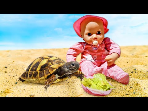 Baby dolls go to the beach and play with sand toys & sand molds. Videos for kids with girls' toys.