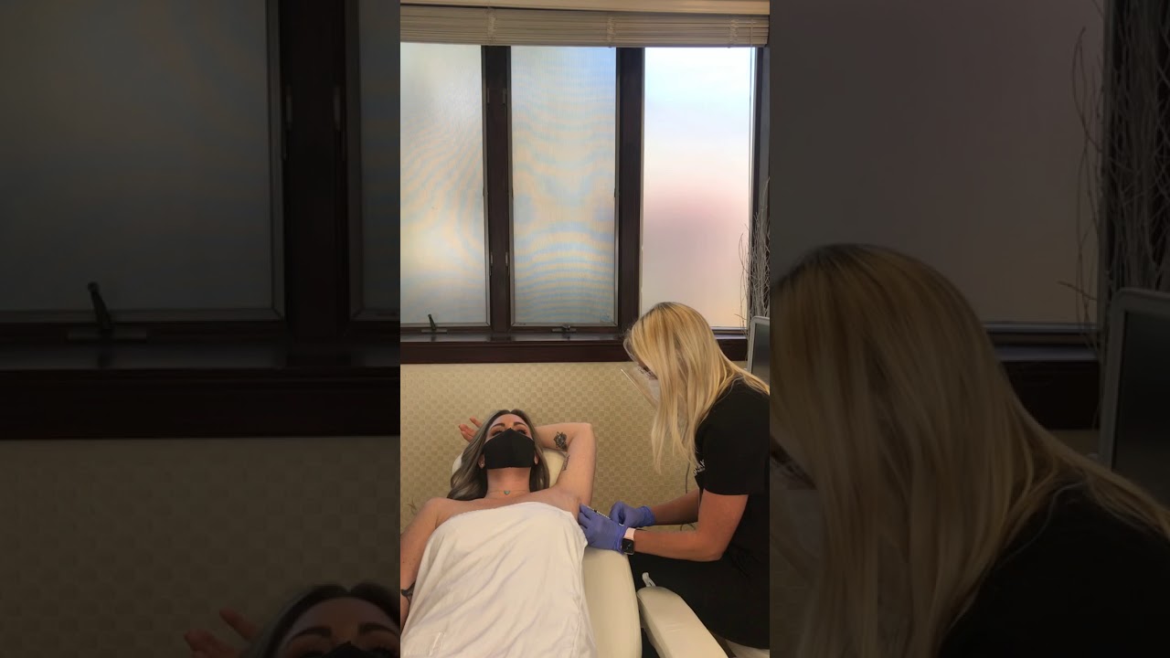 Patient receiving treatment in a medical setting.