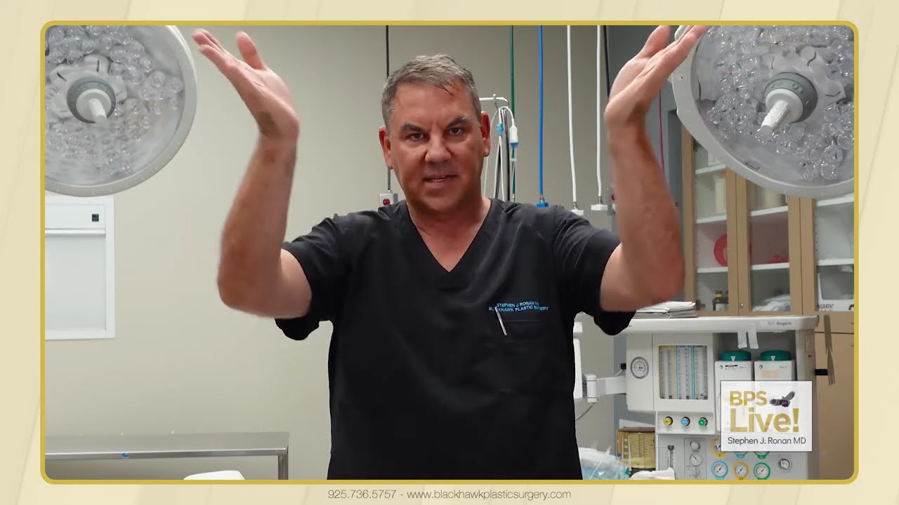 Surgeon demonstrating in a medical setting.