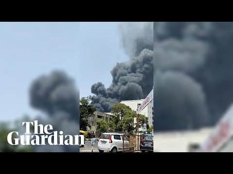 Smoke rises above Ahmedabad in first images from Air India plane crash