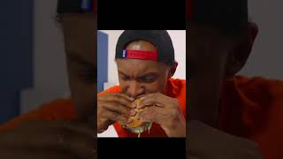 Bok dips his hamburger in the water.