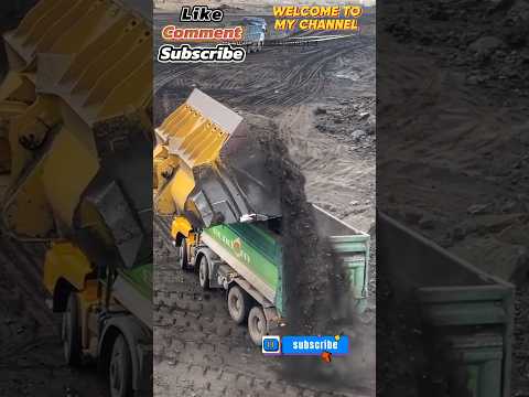 Wheel Loader Caterpillar 992G Loading Coal On The Truck