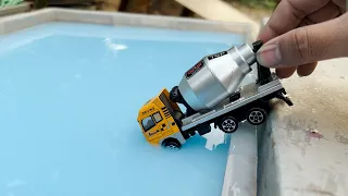 Die cast Model Cars Moving Down On the Slope into a Blue Water