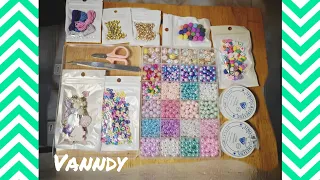 Take rubber beads and string them together to make a bracelet.