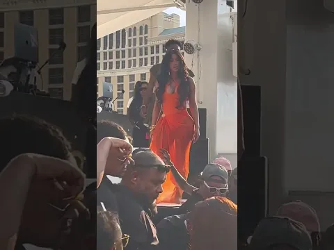 Cardi B throws something at a fan