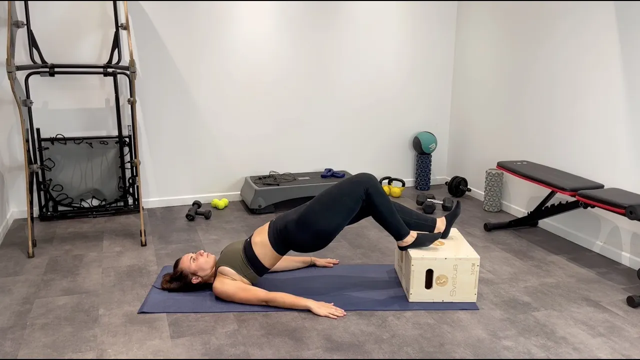 Image Feet Elevated Staggered Glute Bridge