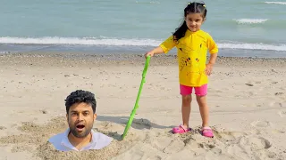 Lil Jaz playing on the beach with sand and toys /ABC SONG