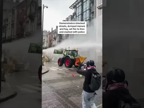 Farmers smash through police barricades and dump manure in protest over EU policies
