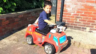 Little Boy Playing on Red Fire Truck Ride on Car, Power Wheel