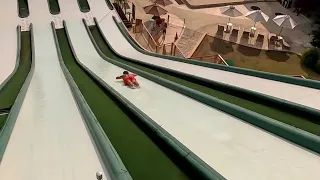Crazy dive  from the Superfly slide in Water park with FPV drone