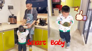 Dad cooks and the cute kid takes the initiative to help with housework