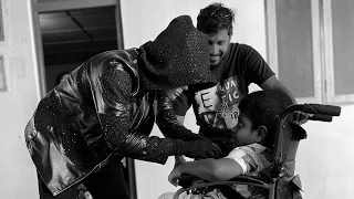 Roboman surprising a kid with a new electric wheelchair!