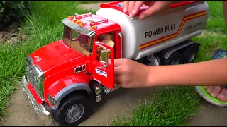 Alex builds a bridge with the help of a truck and a tractor.