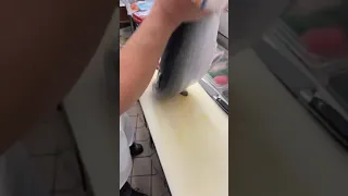 How to cut a whole salmon fish into sashimi.