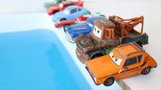 Disney Pixar Cars Rayo McQueen, Tow Mater, Doc Hudson, Monster Truck fall in the Blue Water