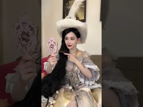 Why is the girl's hair so big?