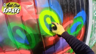 Neon Street Art Squirrel On Garage Door In South London - Fat Cap Sprays