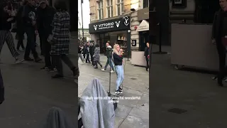 Busker sings “Read all about it” in Piccadilly london.
