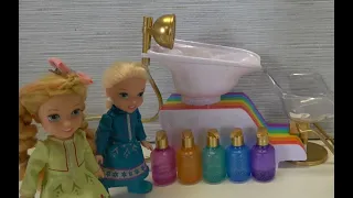 Elsa and Anna toddlers help at the rainbow hair salon