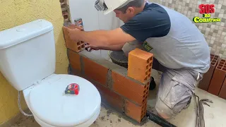 Box no banheiro feito de tijolo