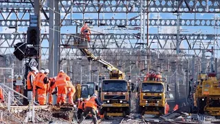 railway staff on over head wire maintenance  in raipur junction