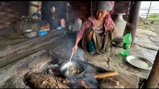 Nepalese village life, cooking chicken.