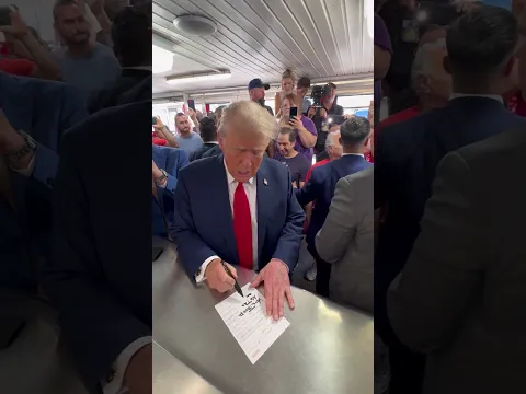President Donald Trump writes on his receipt "NO TAX ON TIPS - VOTE TRUMP" at Tony and Nick's Steaks