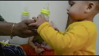 12 months babies fighting for milk bottle | American baby Ishan's first India visit.