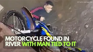 MOTORCYCLE FOUND IN RIVER WITH MAN TIED TO IT