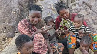 Hadzabe cooking and eating together in the village