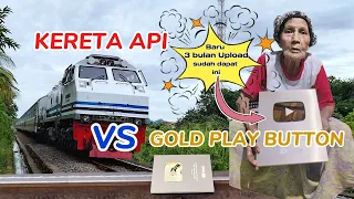 GOLD PLAY BUTTON VERSUS KERETA API