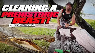 CLEANING AND FILLETING A MONSTER ALLIGATOR GAR (PREHISTORIC DINOSAUR)