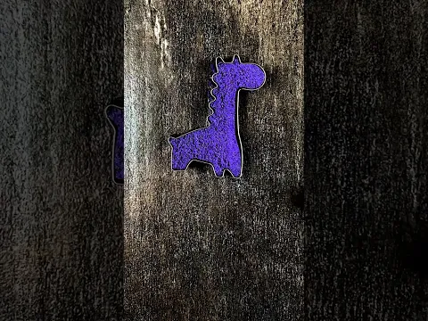 A Giraffe Was Made from Kinetic Sand in the Shape of a Square