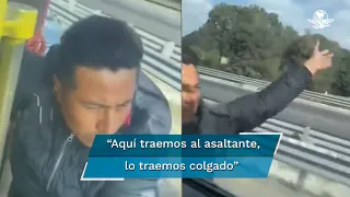 Transportista evita asalto y se lleva a ladrón colgado en plena autopista, al estilo de Tom Cruise