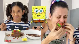 Trollei a Maria com um bolo de esponja