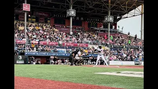 Baseball players are taking their turn at bat during an inning of a Capitales de Quebec game!