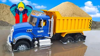 Bruder Mack Dupm Truck stuck in the mud But a Scania Truck pulled it out