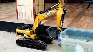 I drove the excavator into the water basin so the frog could climb up and roar at the car.