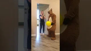 A big fat dog gives Tanya balloons, and Tanya gives the dog a dog toy