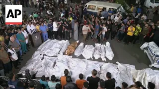 Bodies line up outside Gaza hospital as Israeli airstrikes continue