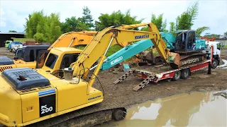 Picking Up The Stuck Kobelco SK210LC Excavator With The Self Loader Truck
