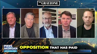 Max Blumenthal wipes smile off US official's face