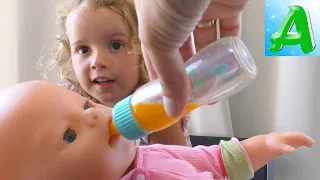 Arina play with doll