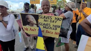 MARCH NO.  10  DLP OPPOSITION LEADER RALPH THORNE JOINS THE MARCH. PROTESTORS CHANT MIA OUT THE DOOR