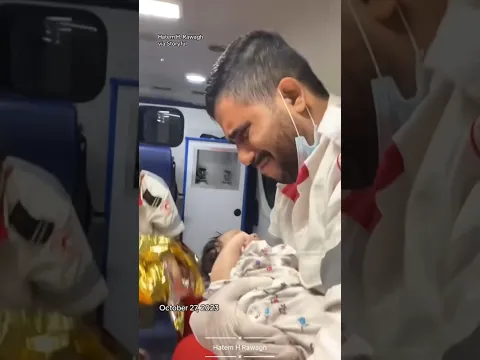 Gaza emergency worker breaks down in tears while cradling baby #shorts