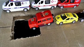Model police cars fall into a hole with water